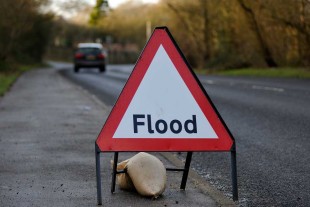 Flood sign on country road