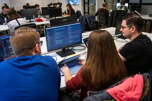 Apprentices looking at a screen