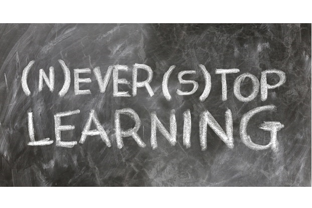 A blackboard displaying the words ‘never stop learning’