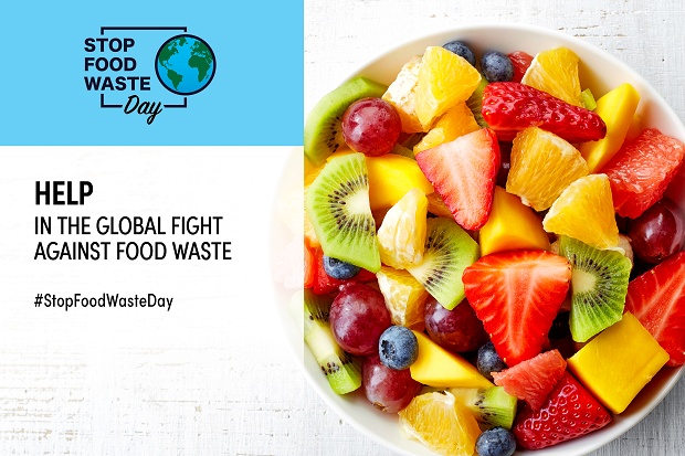 A blue logo with a picture of the earth, and which reads 'Stop Food Waste Day, help in the global fight against food waste', alongside a picture of fresh fruit.